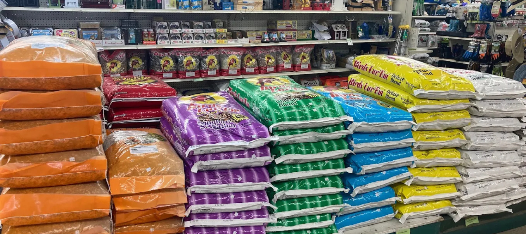 Bird feed and supplies on display inside of Ligonier Agway.
