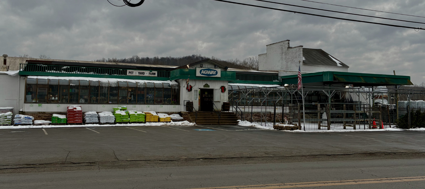 Large garden store with a green awning, labeled 